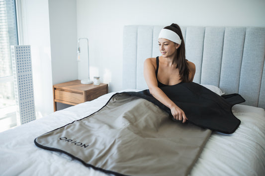 Woman laying in bed with her Orion Embers