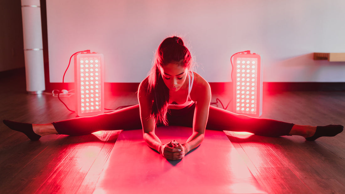 Woman stretching while using Orion 500 - Orion Red Light Therapy