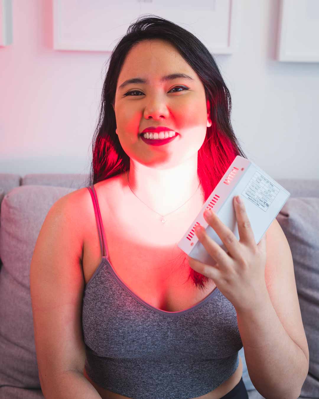 Orion RLT - woman using Orion Edge to target her thyroid